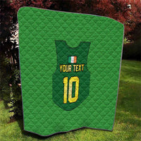 Green quilt with rounded corners, quilted pattern, crest, “YOUR TEXT”, and yellow “10”.