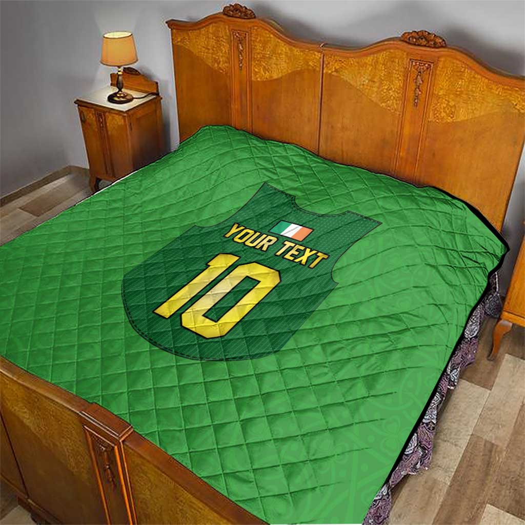Green quilt with quilted pattern, football crest, “YOUR TEXT”, and large yellow “10”.