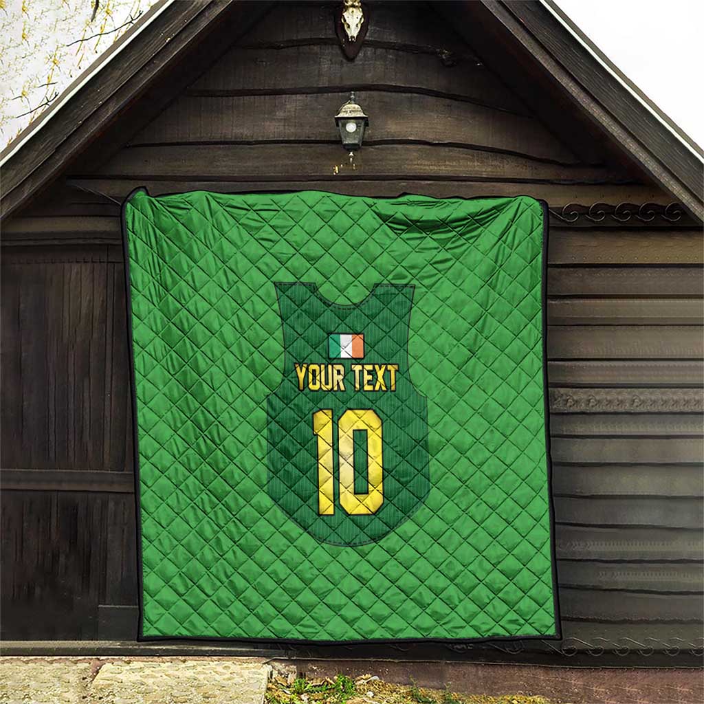 Green personalized quilt with quilted texture, crest graphic, “YOUR TEXT”, and yellow “10”.