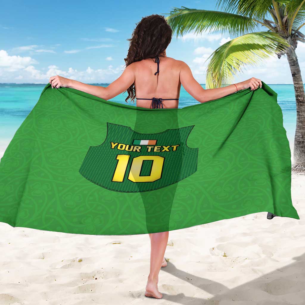 Green rugby sarong with 'YOUR TEXT' and number 10 on back, held stretched