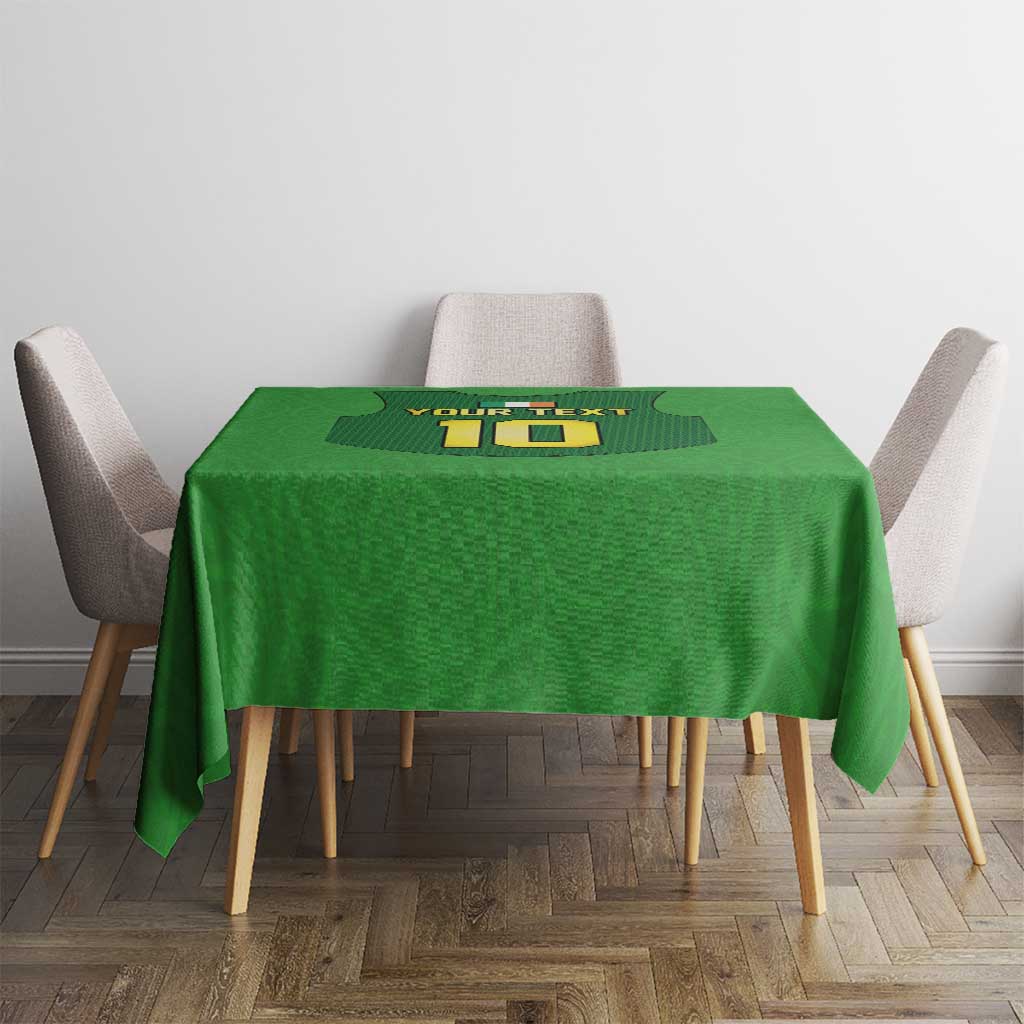 Green tablecloth with rugby-style gilet number graphic, shown on dining table