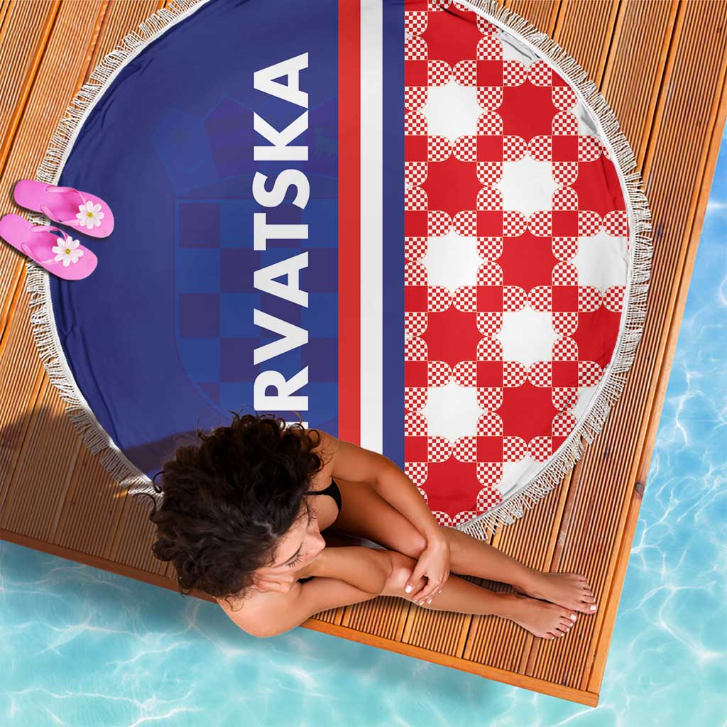 Round beach blanket showing blue panel, red-white check side, vertical red stripe, fringe