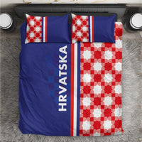 Blue duvet cover with red-and-white checkerboard half, pillows with matching stripe and HRVATSKA.