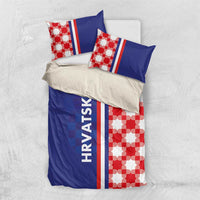 Blue and red-and-white checkerboard bedding set with pillows, striped accents, and HRVATSKA text.