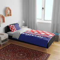 Blue duvet cover with HRVATSKA lettering on the blue panel and red-and-white checkerboard side.