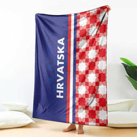 Blue and red checkerboard blanket with white center stripe and "HRVATSKA" lettering