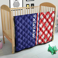 Blue and red check crib quilt with HRVATSKA stripe and diamond stitch pattern