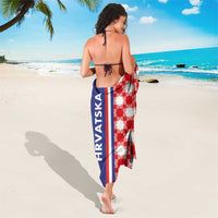 Red and white checkerboard half sarong with navy vertical stripe and tie closure