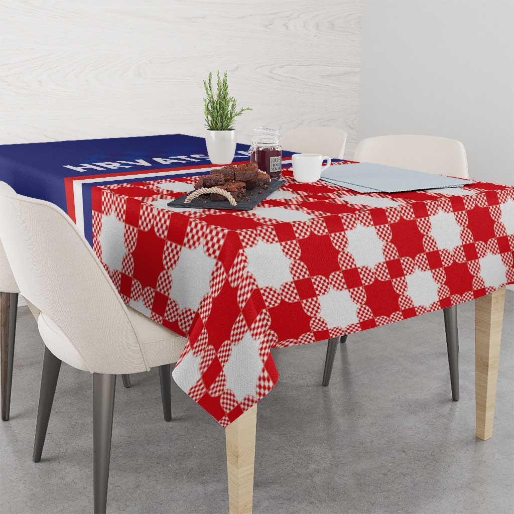 Red and white checkerboard tablecloth with blue stripe panel, draped on dining table
