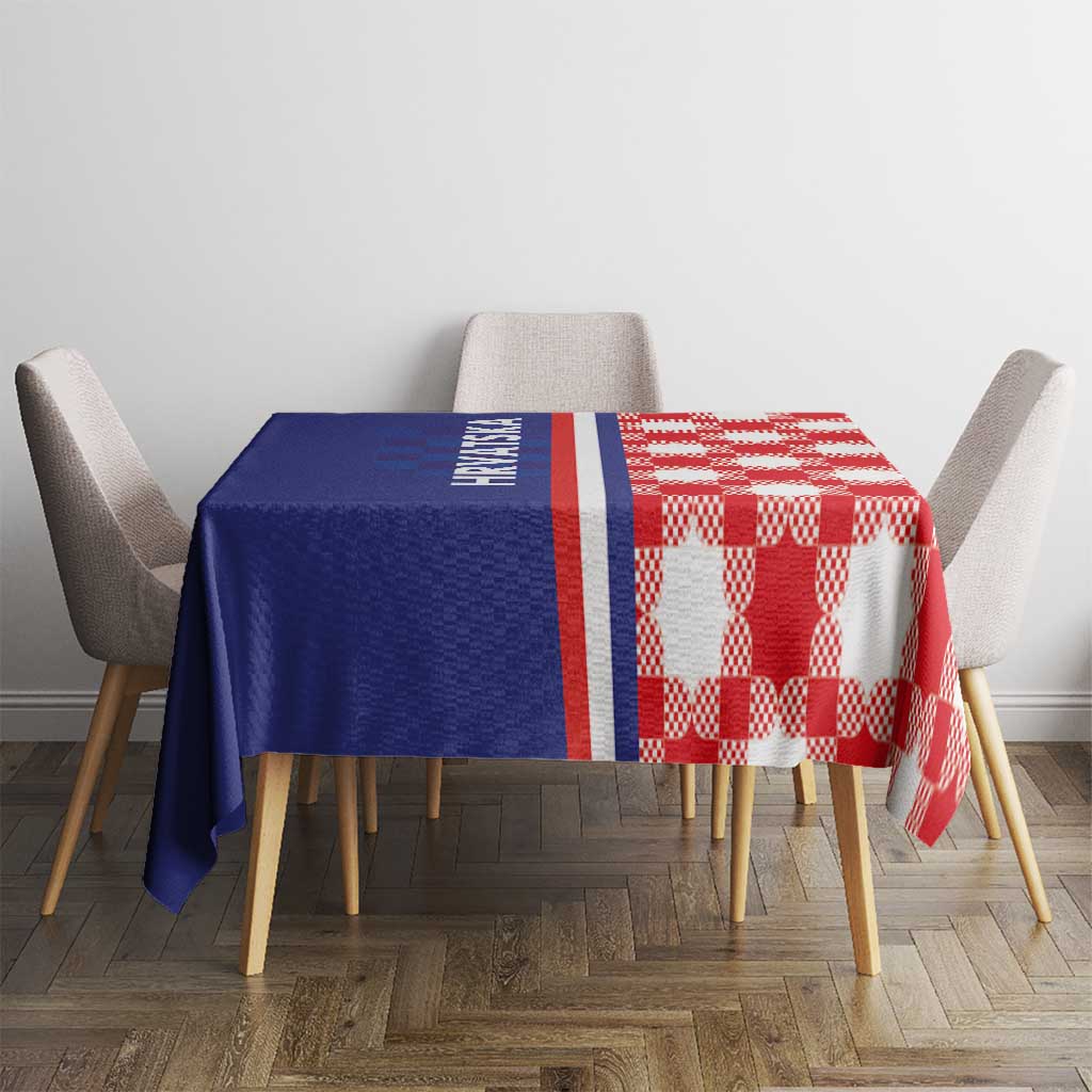 Blue and red checkered tablecloth with white and red border stripes on dining table