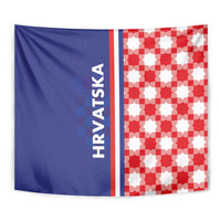Checkerboard tapestry with blue left half showing HRVATSKA text and red-white check right half