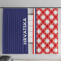 Blue window curtain with vertical HRVATSKA text, paired with red and white checkerboard curtain
