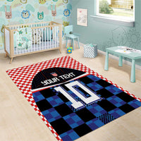 Football jersey area rug with red/white checker edge and blue black pixel squares, #10