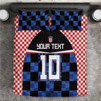 Bedding set close-up: red-and-white checks with blue-black jersey design and “YOUR TEXT” 10