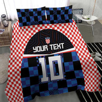 Bedding set featuring red-and-white checks, blue-black jersey print with “YOUR TEXT” 10
