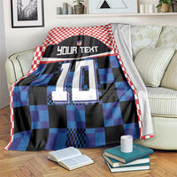 Football jersey blanket, red-white check border, blue/black pixel jersey print with 'YOUR TEXT' 10