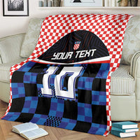 Football jersey blanket, red-white check border, blue/black pixel jersey with 'YOUR TEXT' and 10