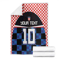 Football jersey blanket, red-white check border, blue/black pixel jersey print, 'YOUR TEXT' 10