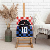 Football jersey canvas wall art with red check pattern, blue pixel blocks, number 10