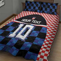 Football jersey quilt bed set featuring blue-and-black check design with red gingham side panels.