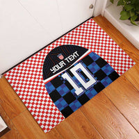 Custom football jersey rubber doormat with red checkered border and blue pixel jersey 10
