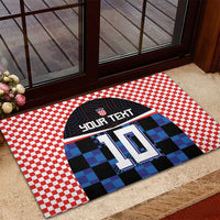 Custom football jersey rubber doormat with red checkered border and blue pixel jersey 10 on step
