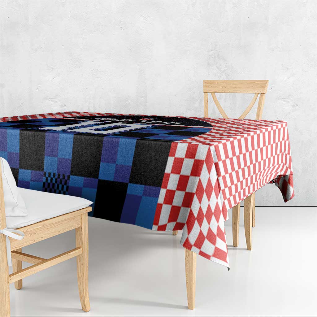 Blue and black jersey graphic tablecloth with red-and-white checkered edge on bench