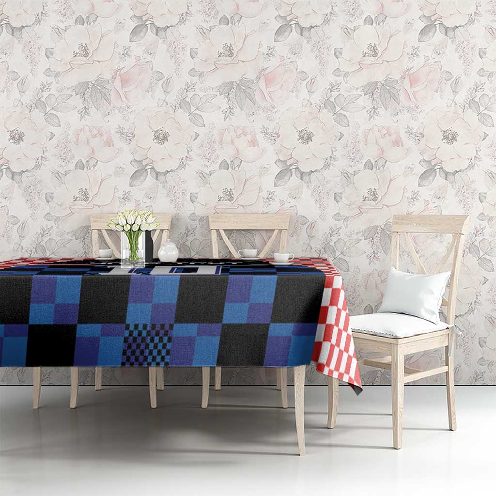 Blue and black jersey graphic tablecloth with red-and-white trim on dining table