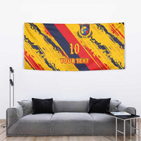 Football tapestry with '10' emblem, yellow/red/navy diagonal stripes, and 'YOUR TEXT' print