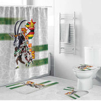 White bathroom set with graphic shower curtain, toilet lid cover, and bath rugs