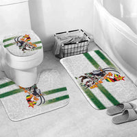 Bath rugs set with green stripe and team graphic, placed on bathroom floor