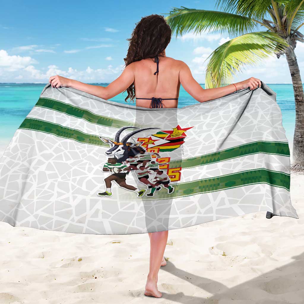 White rugby sarong with green band and emblem graphic, back drape