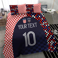 Bedding set with red-and-white checker pillowcases and navy duvet with custom text and number 10