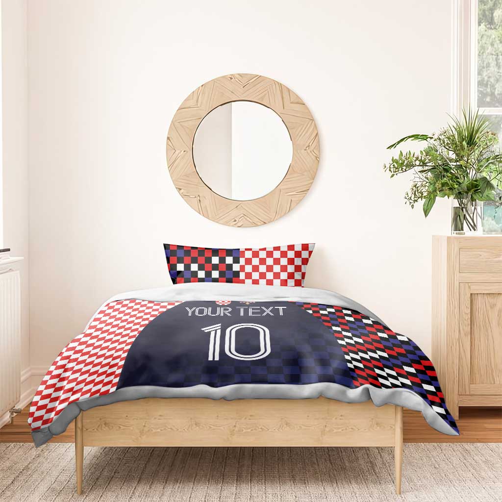 Bedding set with navy duvet featuring custom text and number 10, paired with red-and-white checker pillows
