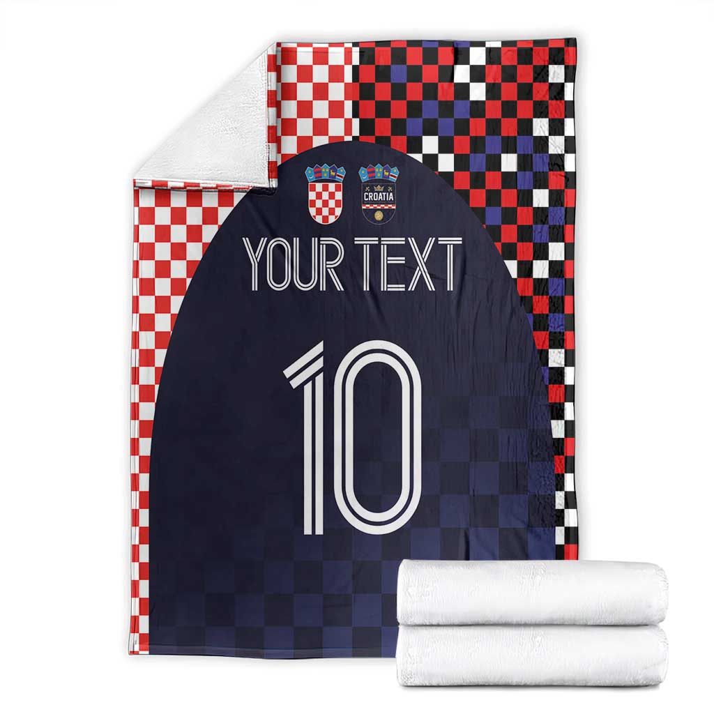 Folded dark navy football blanket with red-white checkered border, 'YOUR TEXT' and 10