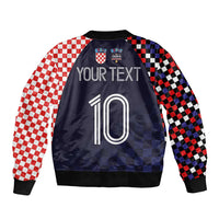 Dark navy bomber jacket with red/black checkered sleeves, back graphic, number 10 and crest