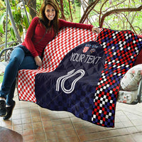 Quilt with red-and-white checkered layout and dark navy soccer number 10 centerpiece