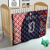 Dark navy quilt with red-and-white checker blocks and a large soccer number 10