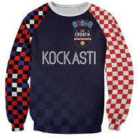 Dark navy raglan sweatshirt with checker sleeves; Croatia crest and KOCKASTI graphic