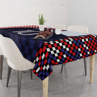 Dark navy checkered tablecloth with bold red, black, and white square pattern
