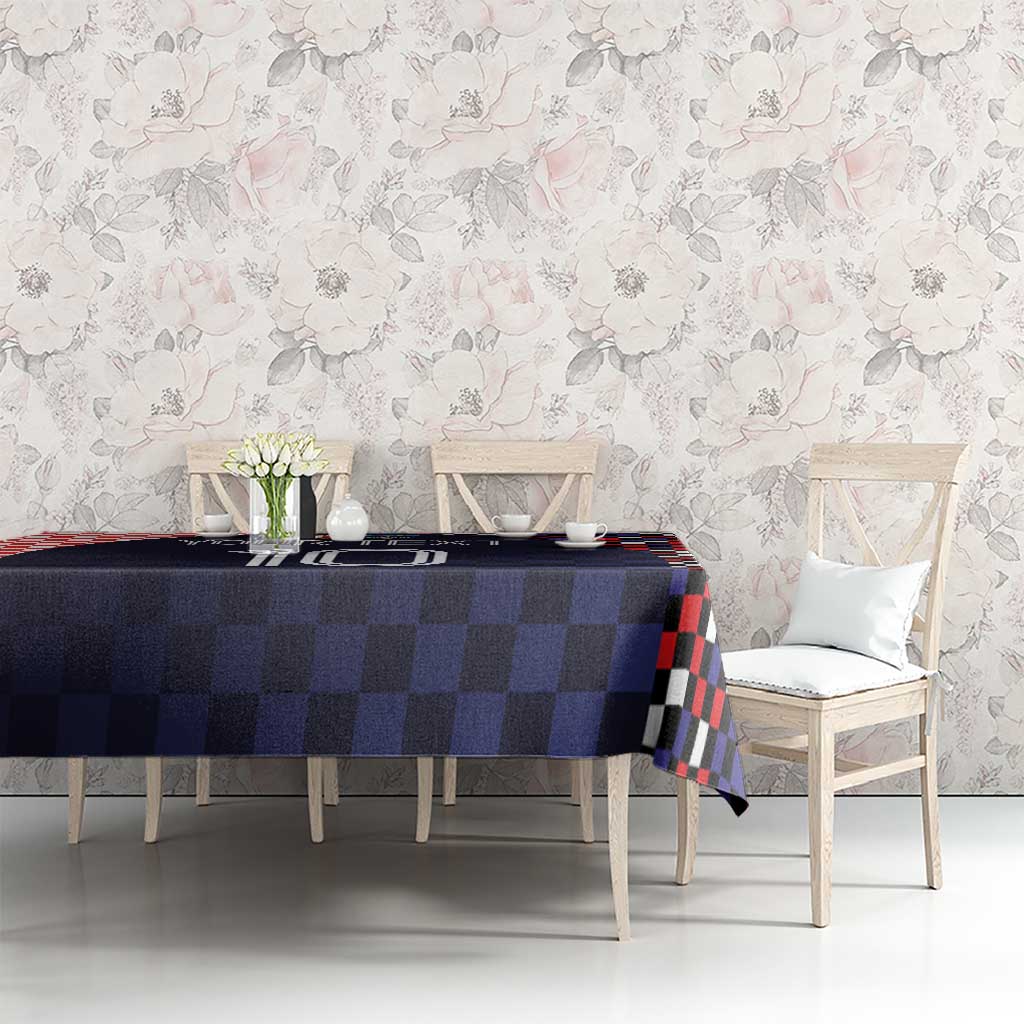 Dark navy checkered tablecloth on dining set with red and black checkered border