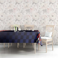 Dark navy checkered tablecloth on dining set with red and black checkered border