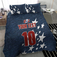 Denim-style bedding set with navy star pillows and comforter showing US logo, 'YOUR TEXT' and '10'