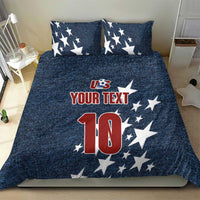 Denim-style bedding set with navy star pillows and comforter featuring US logo, 'YOUR TEXT' and '10'