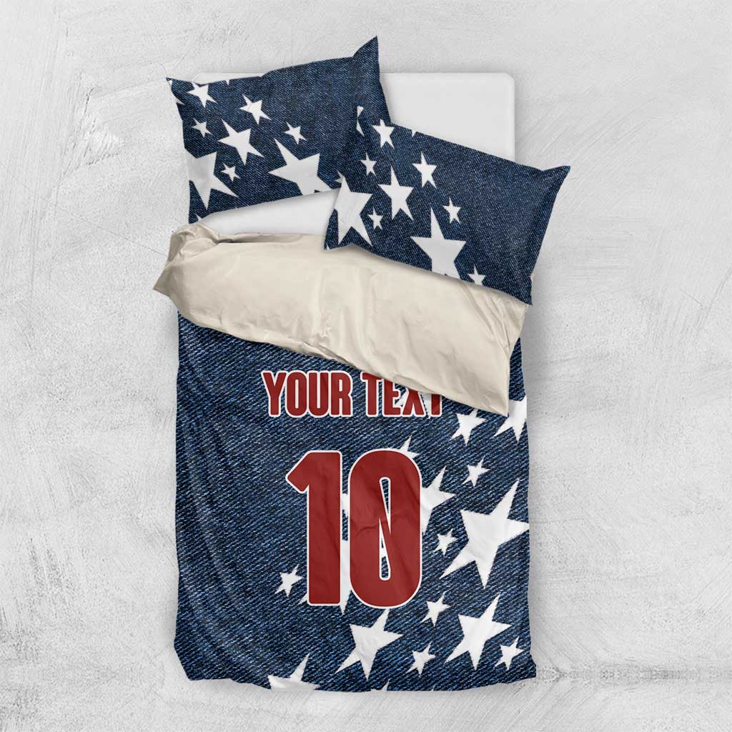 Denim-style bedding set with navy star pillows and comforter showing 'YOUR TEAM' and red '10'