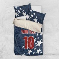 Denim-style bedding set with navy star pillows and comforter showing 'YOUR TEAM' and red '10'