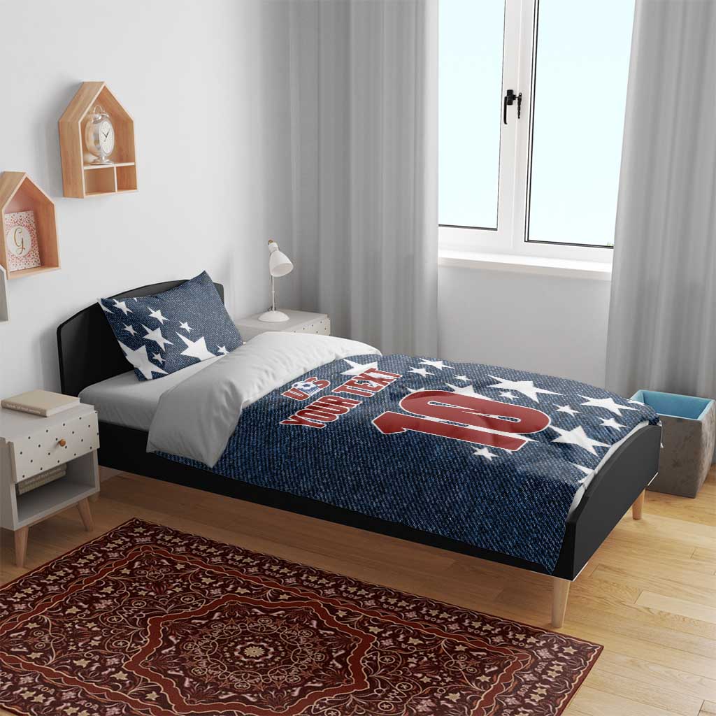 Denim-style bedding set with navy star comforter featuring US logo, 'YOUR TEXT' and '10' with pillows
