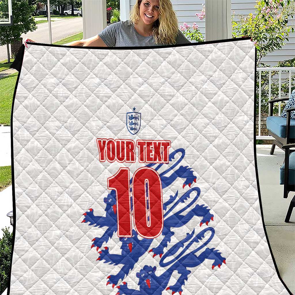 White quilt blanket outdoors with England crest and quilted pattern, red No. 10 graphic.