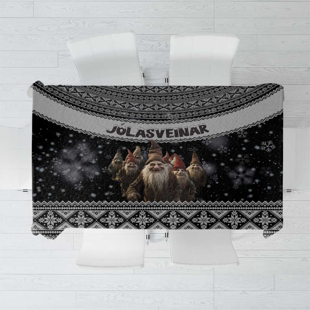 Black Nordic tablecloth with elf faces and “JOLASVEINAR” text