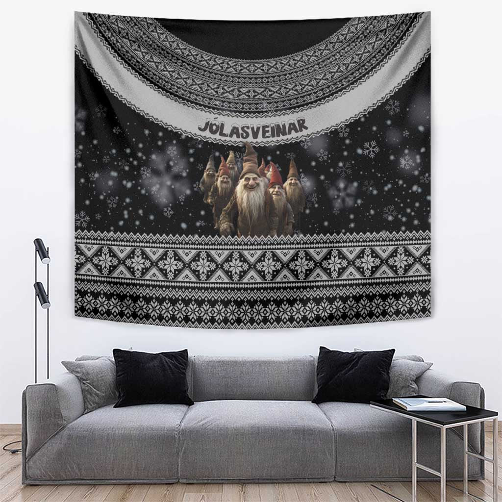 Black Christmas tapestry with Nordic border, starry scene, and three Yule lads faces